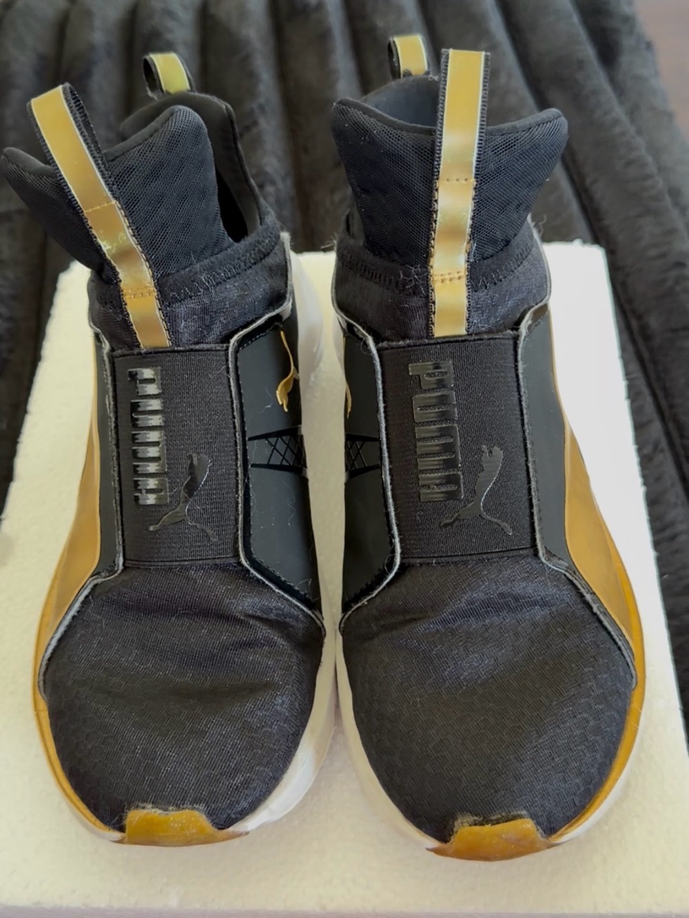 Puma Black and Gold Slip-On Athletic Sneakers